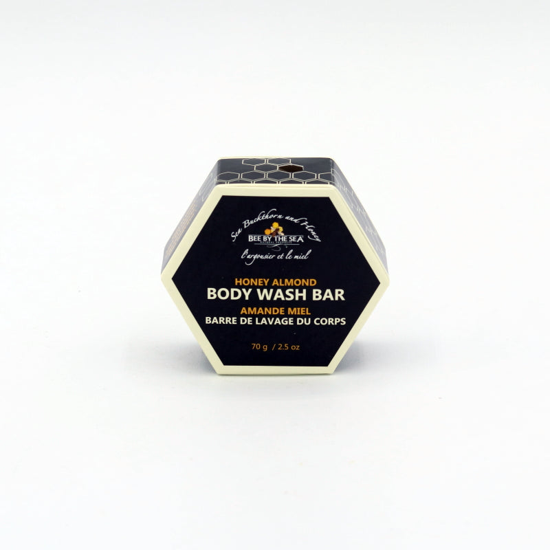Hexagonal container of Honey Almond Body Wash Bar on a white background