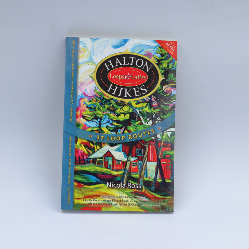 A book titled 'Halton Hikes' with a colorful cover featuring illustrations of a map and landscapes, indicating it is a guide for hiking trails.