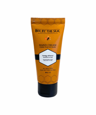 Hand cream tube with 'Bee By The Sea' branding on a white background