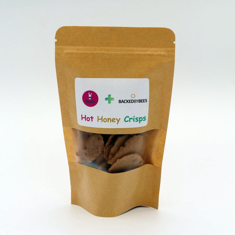 Kraft paper packaging of 'Hot Honey Crisps' with brand label on a white background