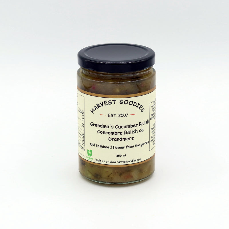 Jar of cucumber relish with 'Harvest Goodies' label on a white background